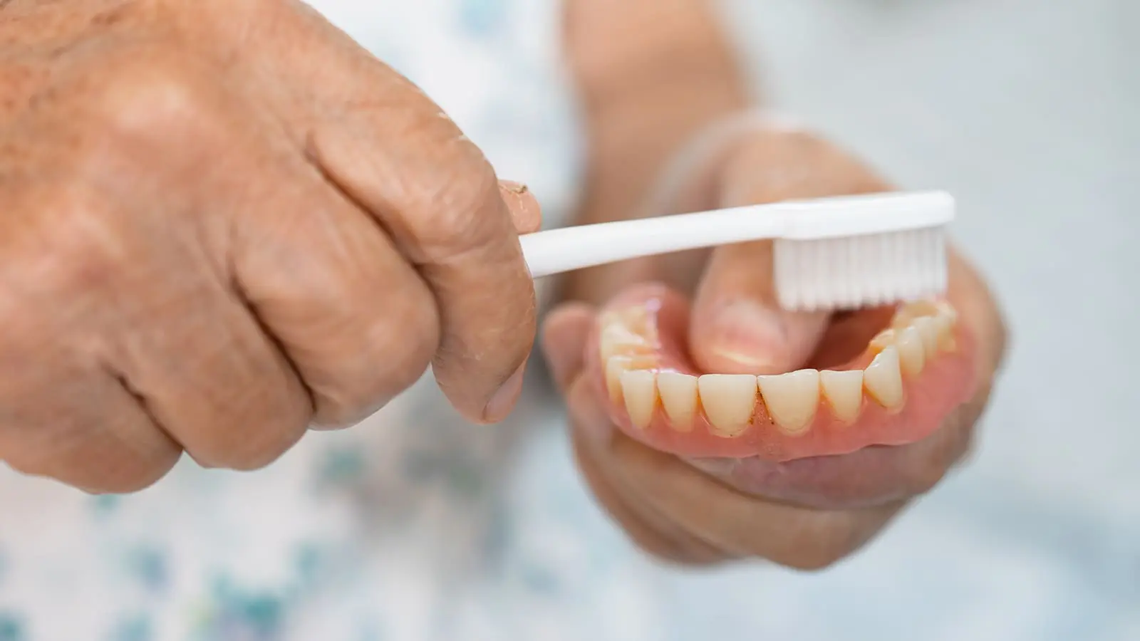 How to Clean and Maintain Your Implant Dentures